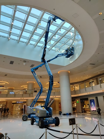 a man on a scissor in a large building