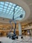 a man on a scissor in a large building