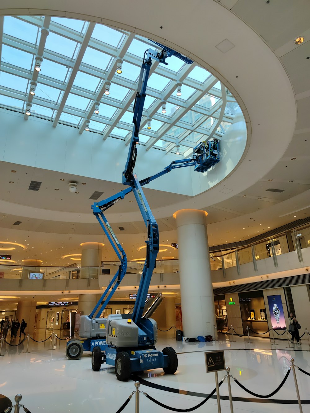 a man on a scissor in a large building