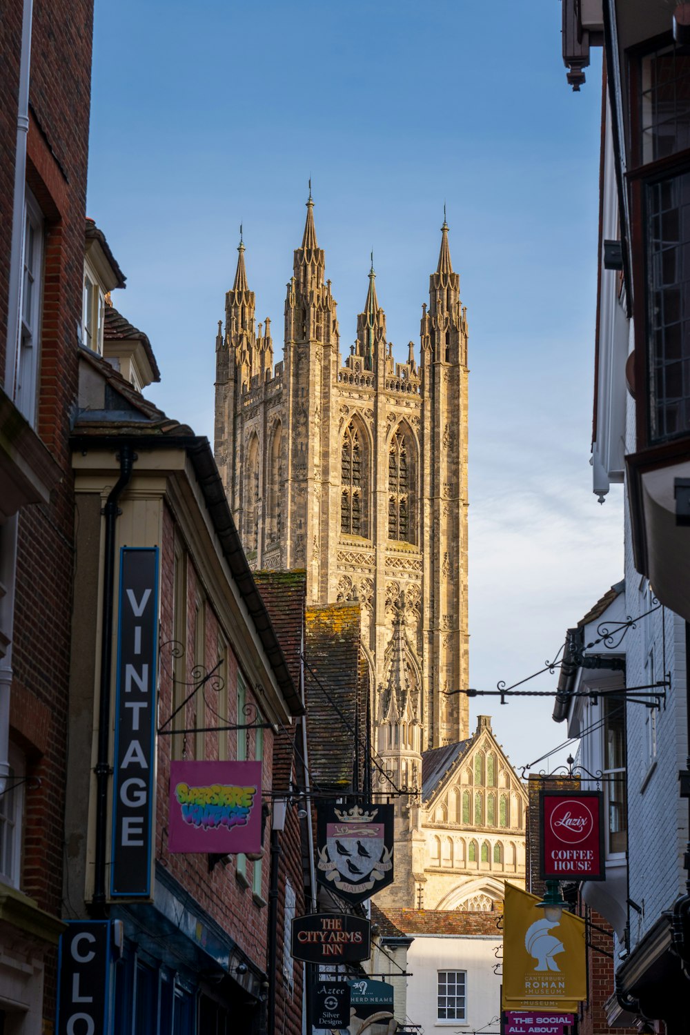 a large cathedral towering over a city filled with tall buildings