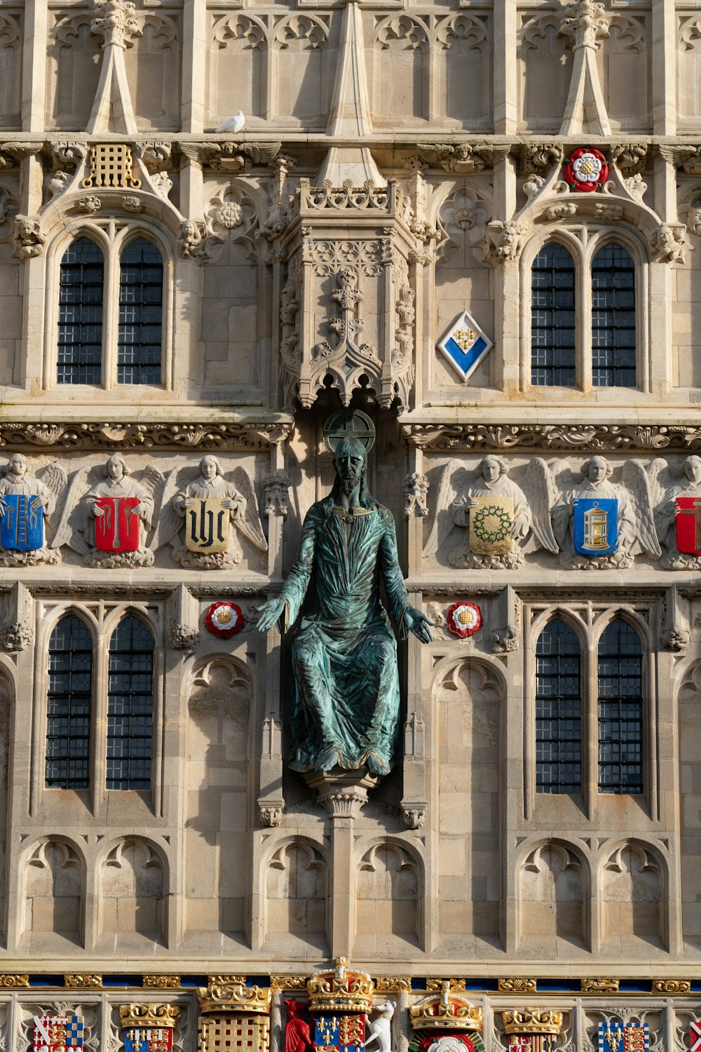 a large building with a statue on the side of it