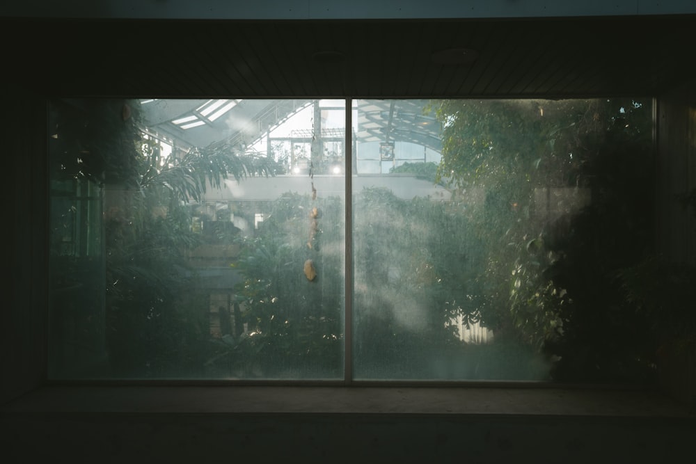 a window with a view of a house through it