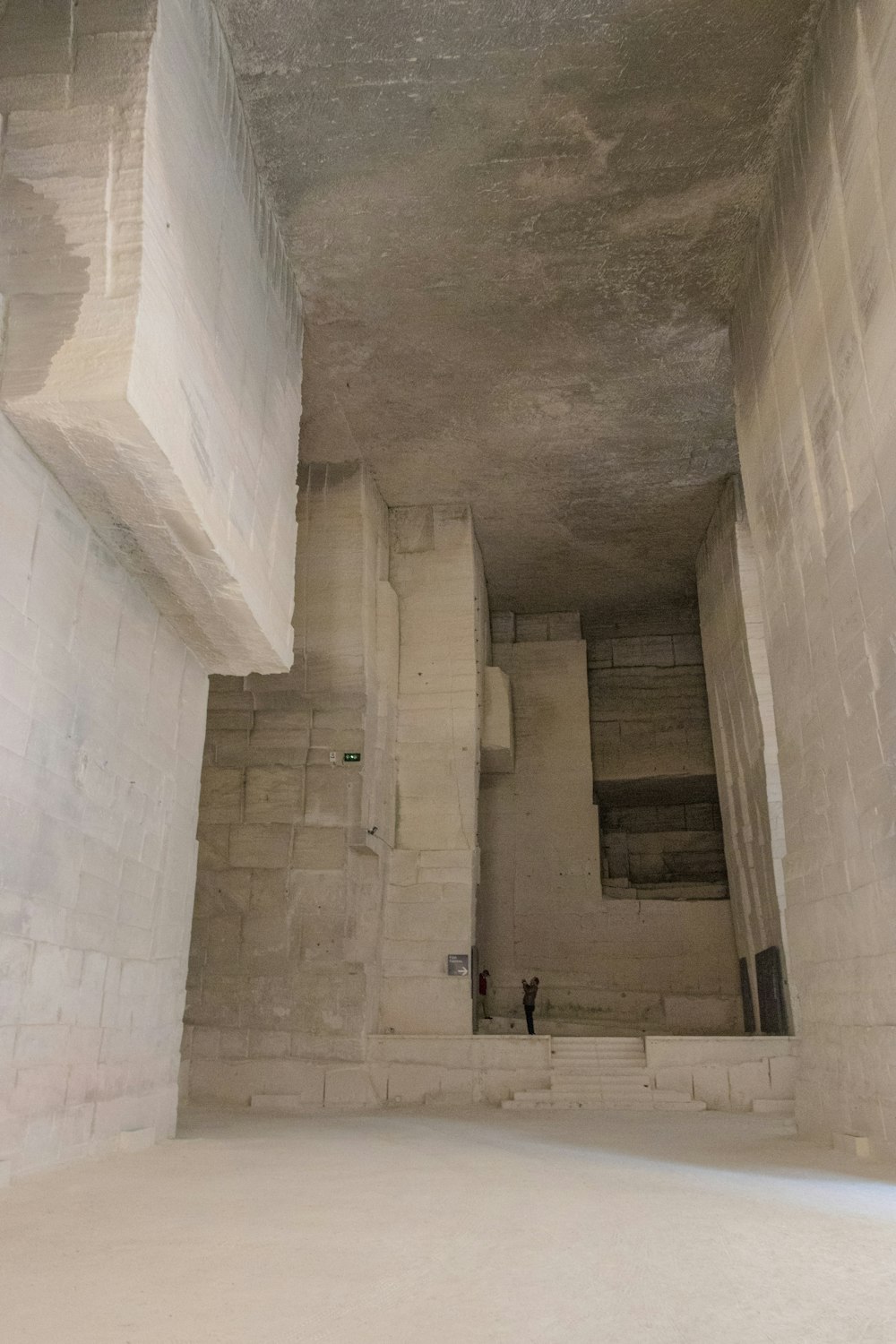 a person standing in a room with a ceiling