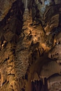a group of people standing in a cave
