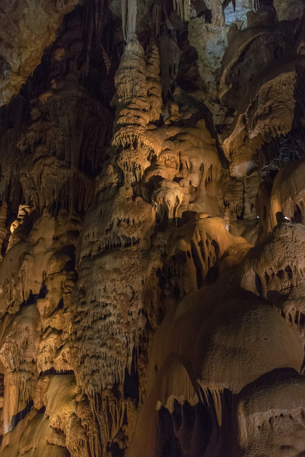 a group of people standing in a cave