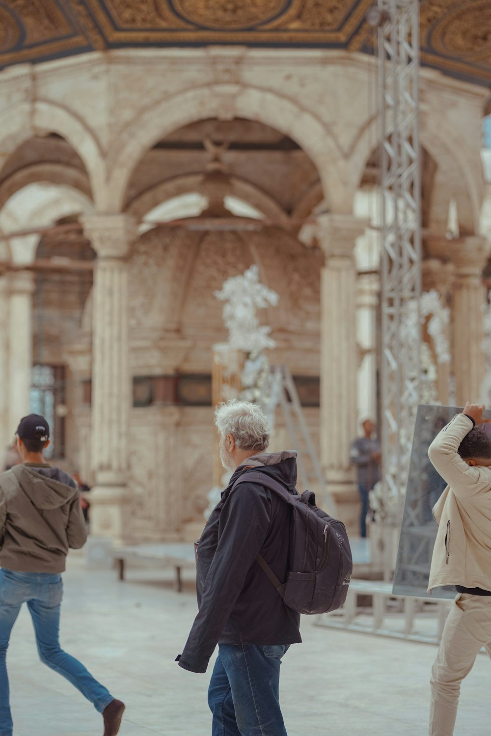 a group of people walking around a building