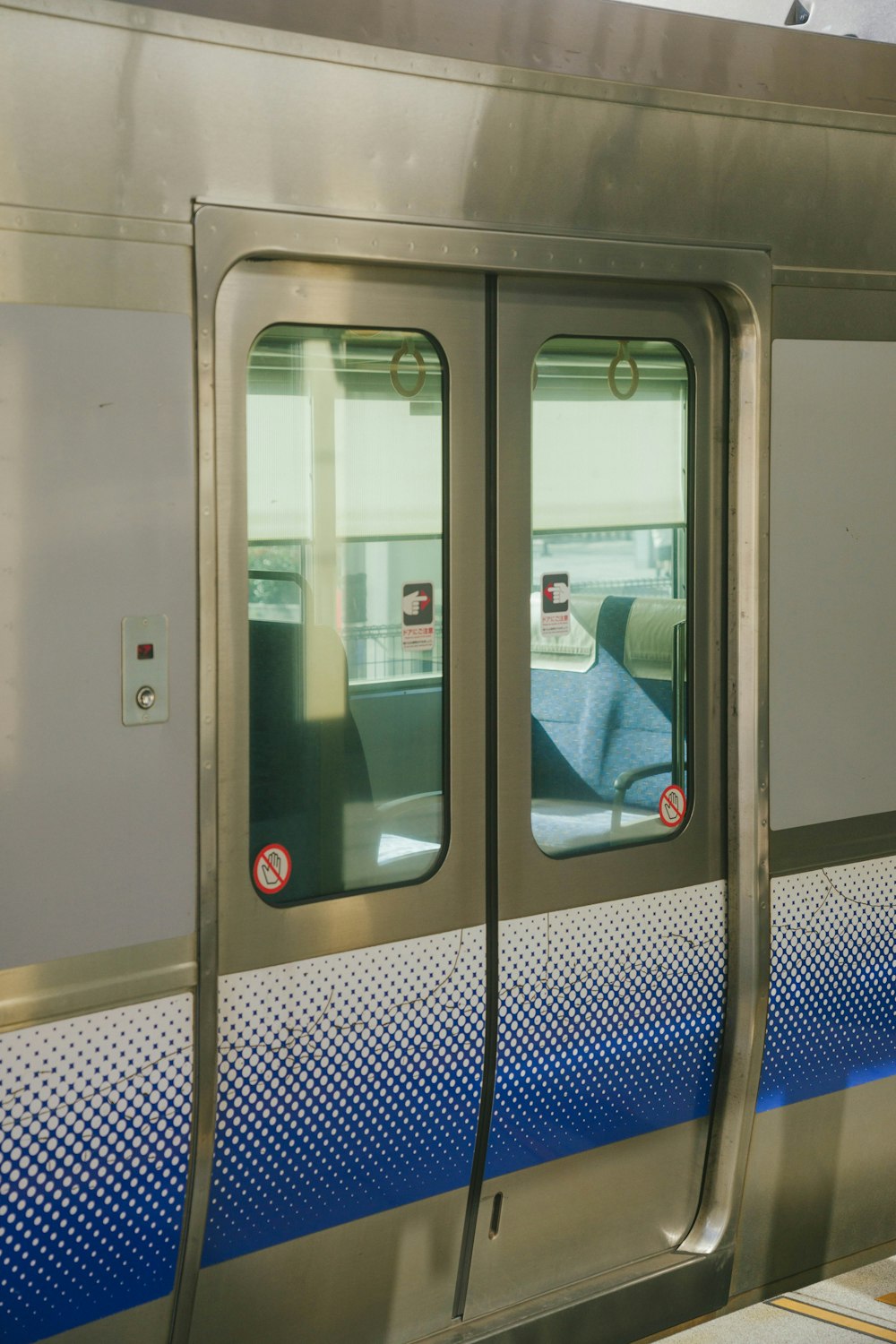 a subway train with its doors open at the station