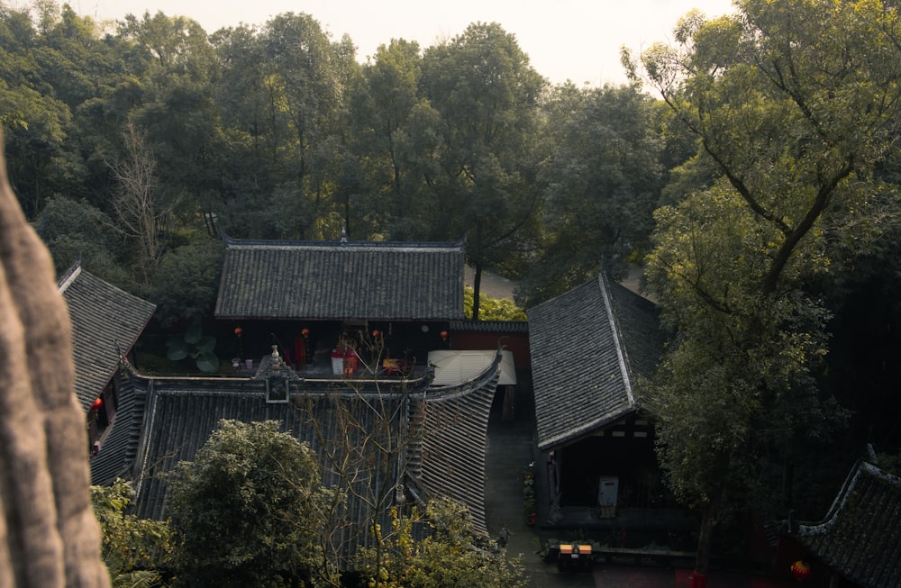 an aerial view of a building surrounded by trees