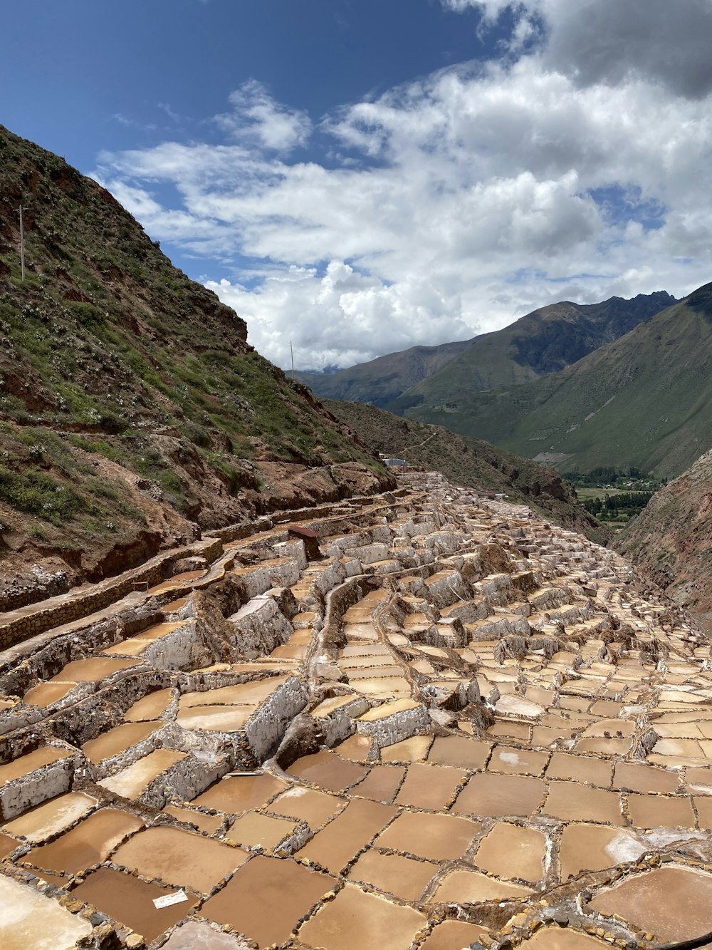 a stone road in the middle of a mountain range