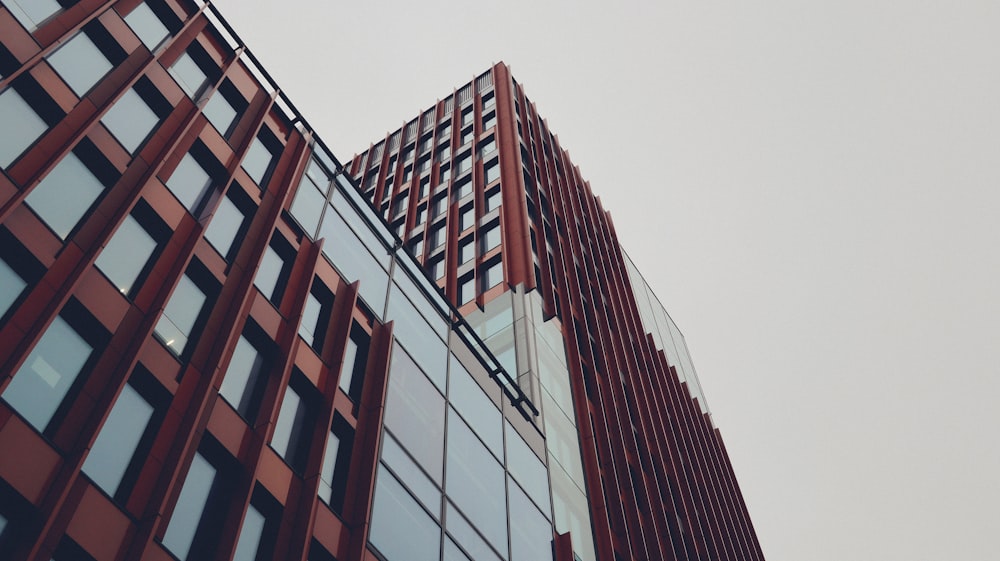 a tall red building with lots of windows