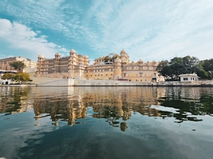 a large building sitting on top of a lake