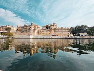 a large building sitting on top of a lake