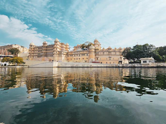 a large building sitting on top of a lake