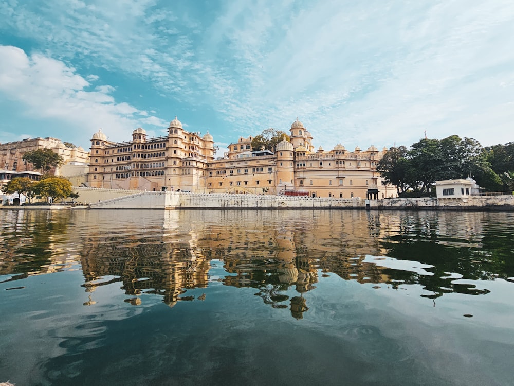 a large building sitting on top of a lake