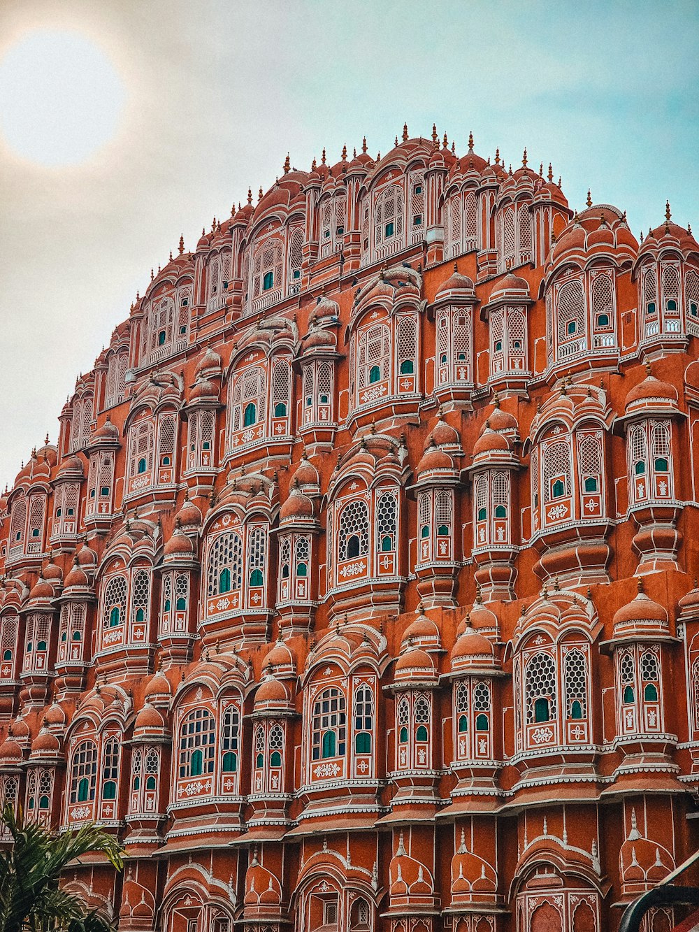 a very tall building with many windows and balconies