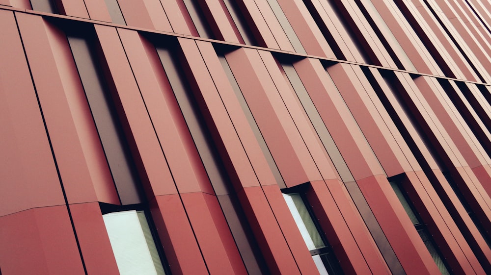 a tall red building with lots of windows