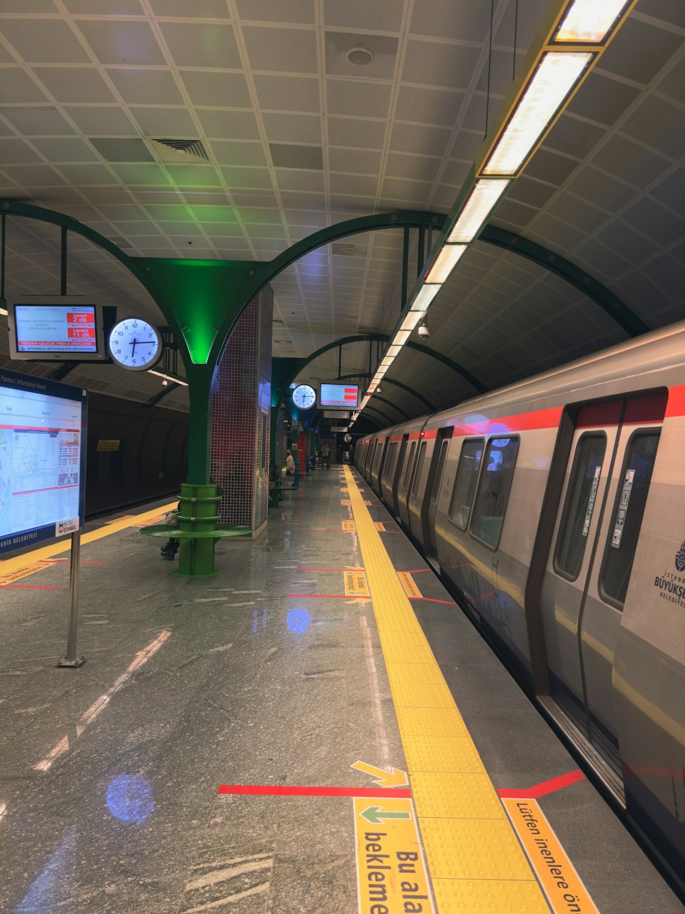 a subway train pulling into a train station