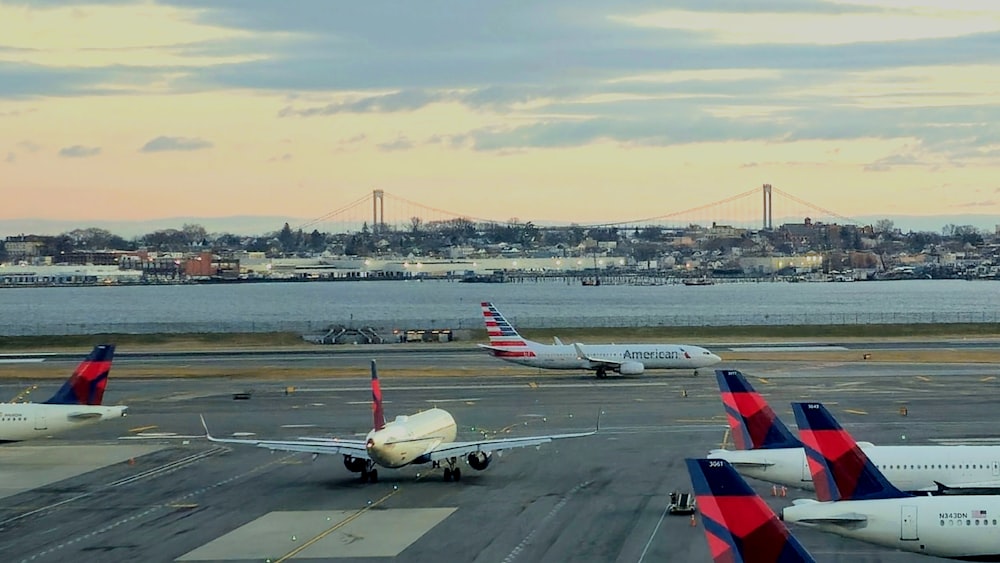 a bunch of airplanes that are on a runway