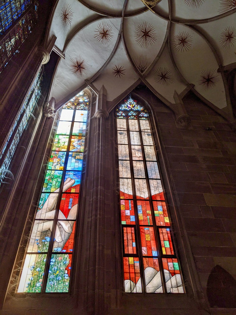 a large stained glass window inside of a building