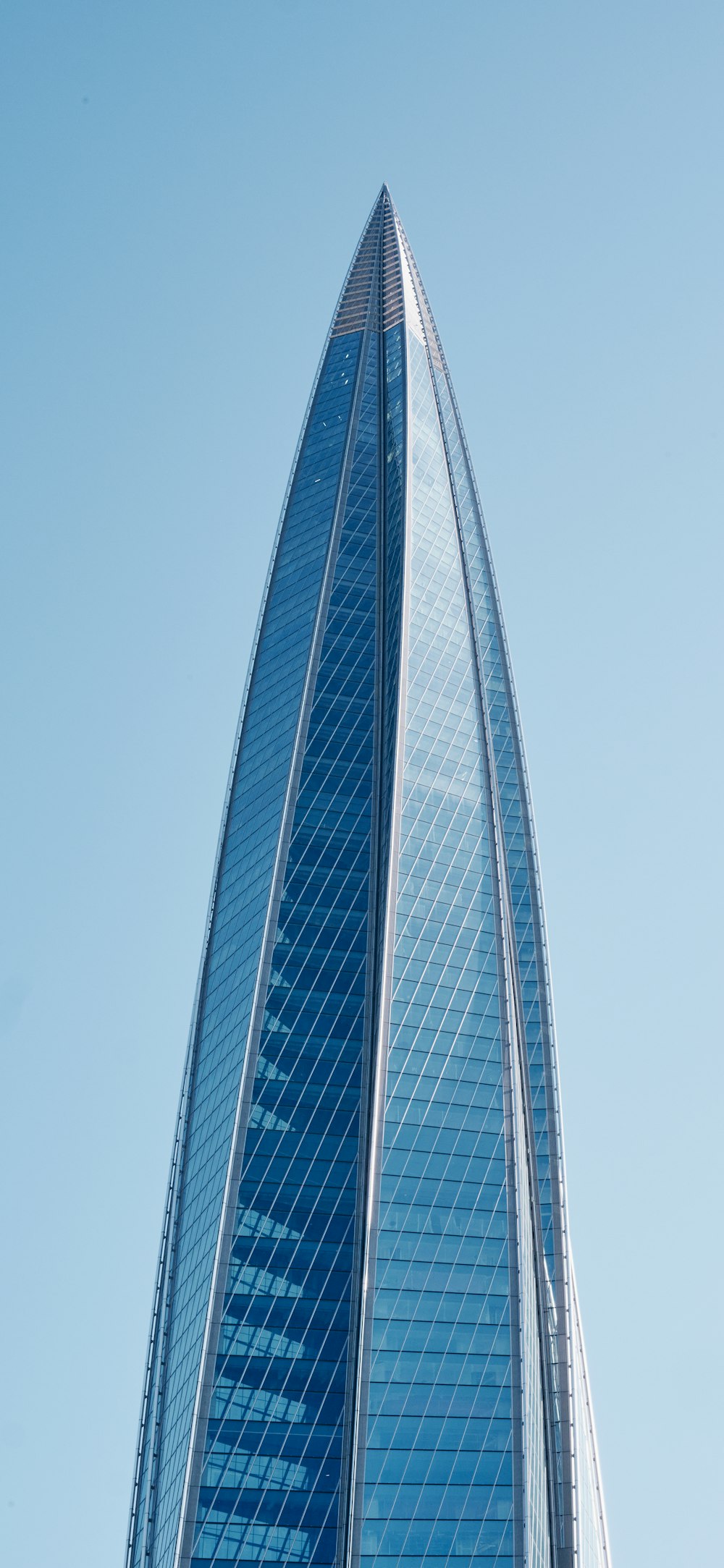 a very tall building with a sky background