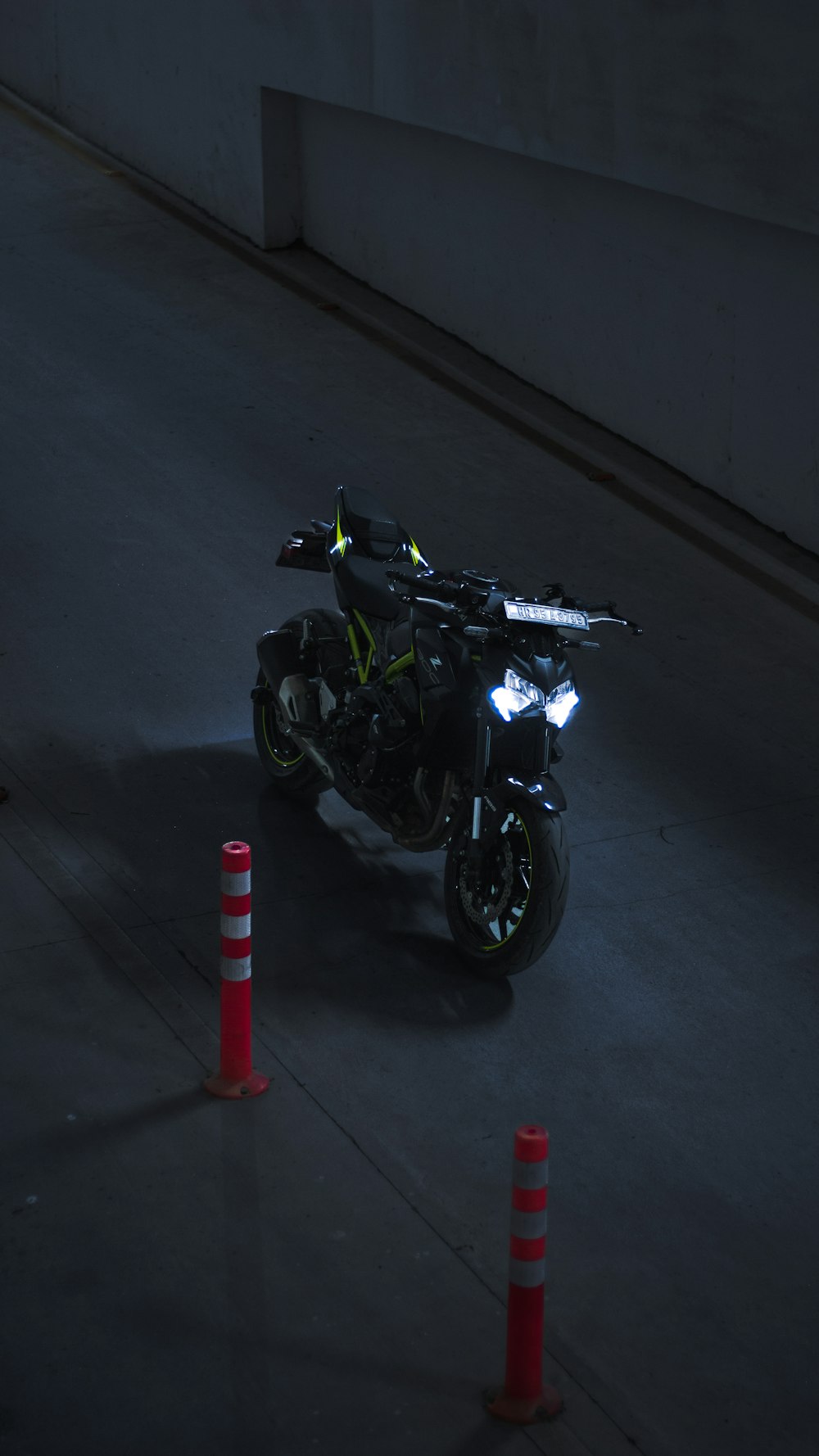 a motorcycle parked in a parking lot at night