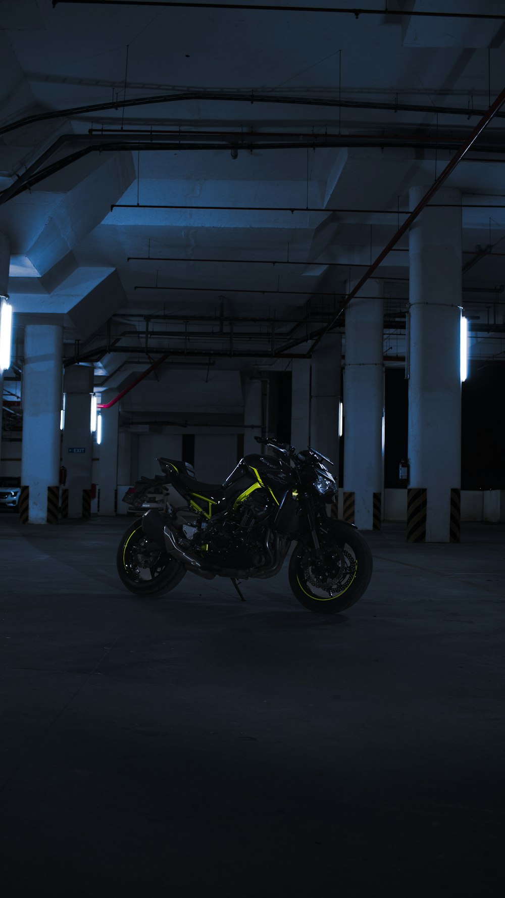 a motorcycle is parked in a parking garage