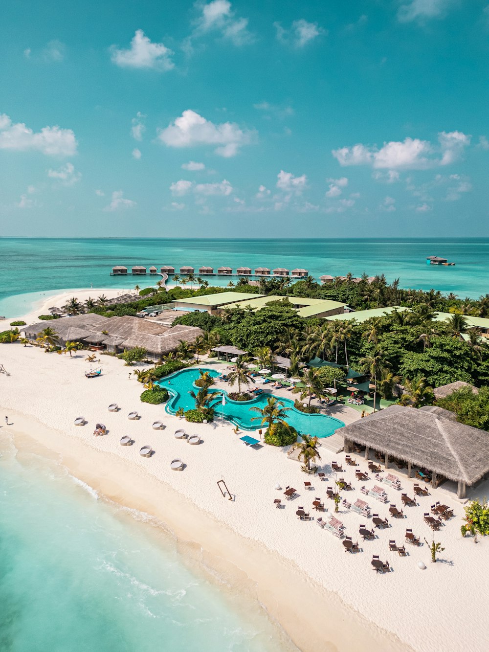 an aerial view of a resort on a tropical island