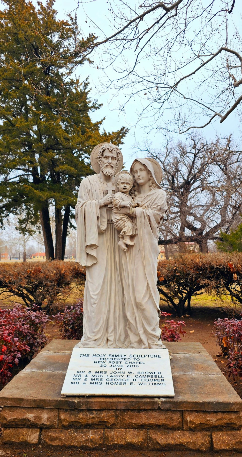 a statue of a man holding a child