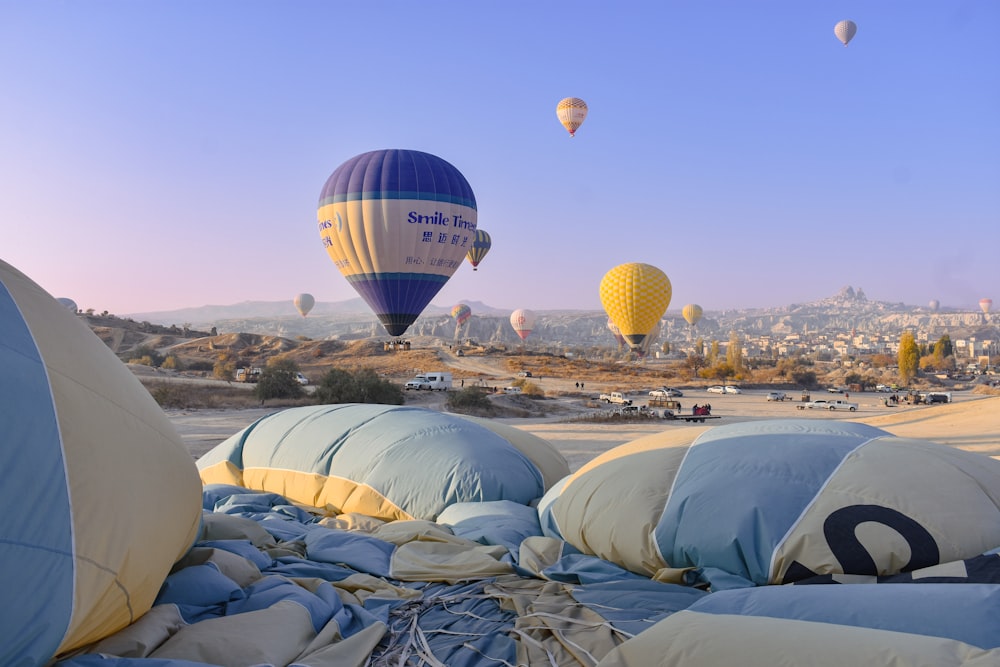 a bunch of hot air balloons flying in the sky