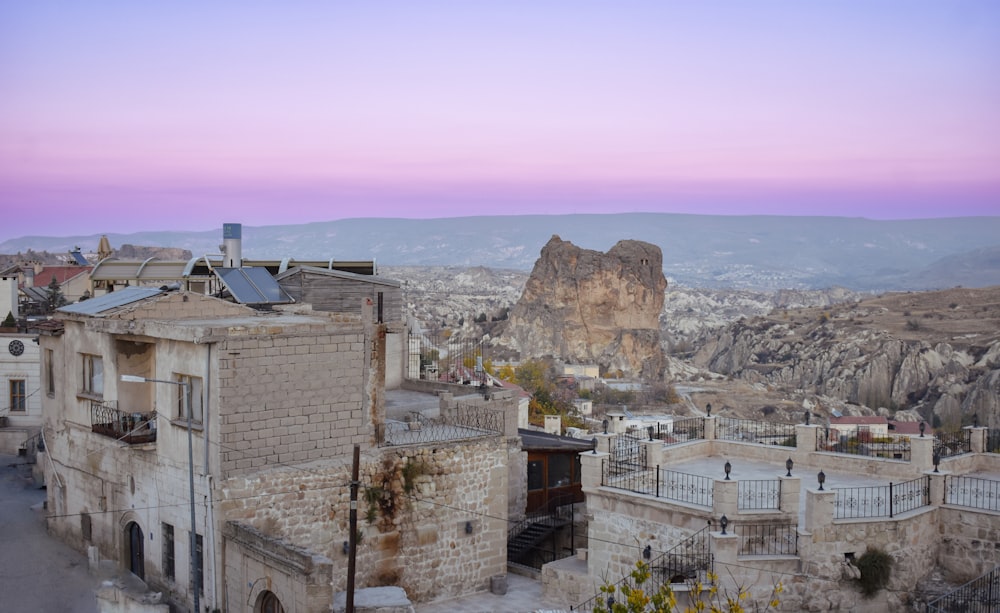 a view of a city with mountains in the background