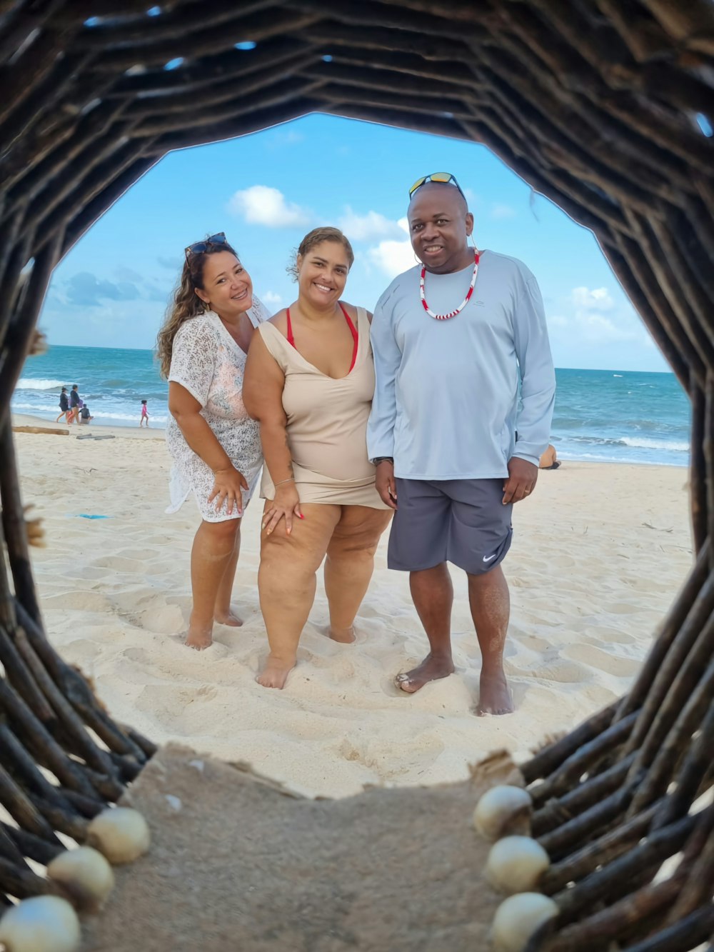 a couple of people that are standing in the sand