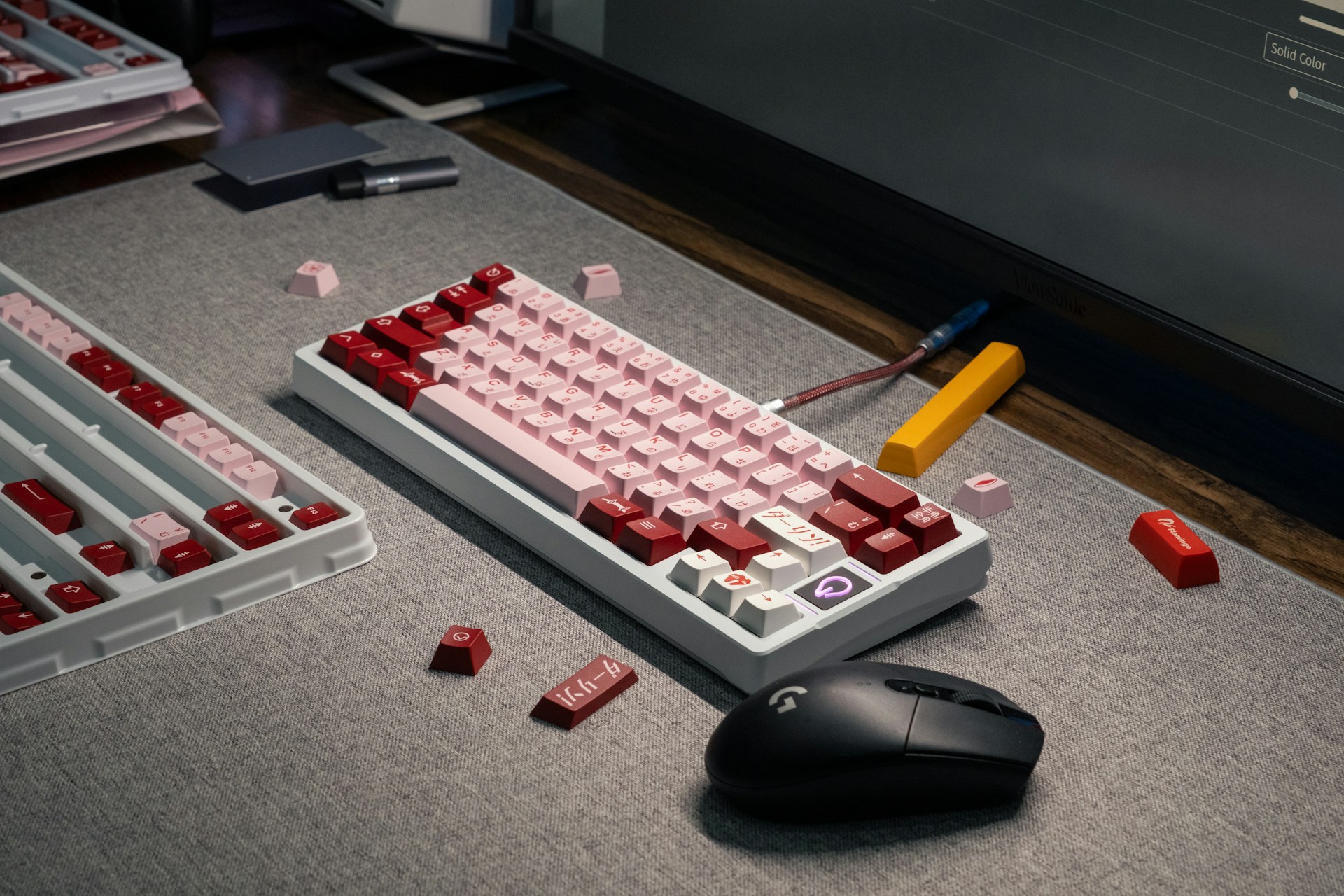 a computer keyboard and a mouse on a table