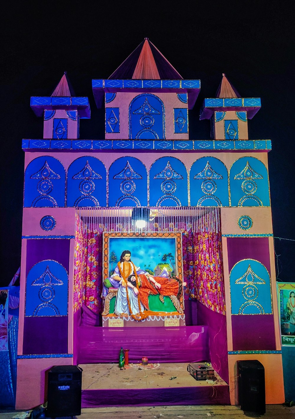 a stage with a painting on it at night