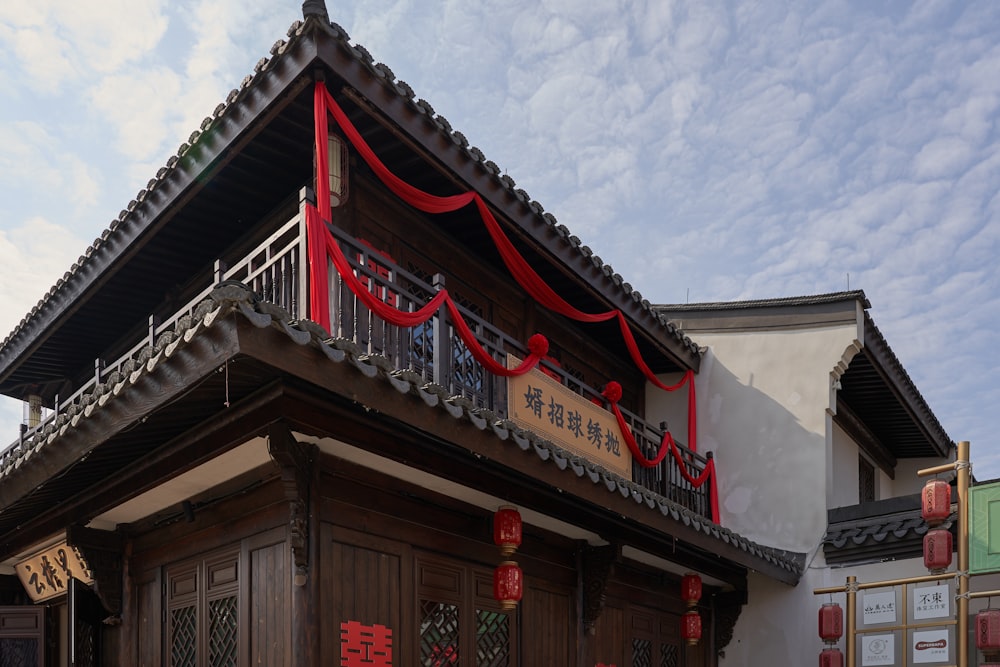 a building with a red ribbon on the top of it