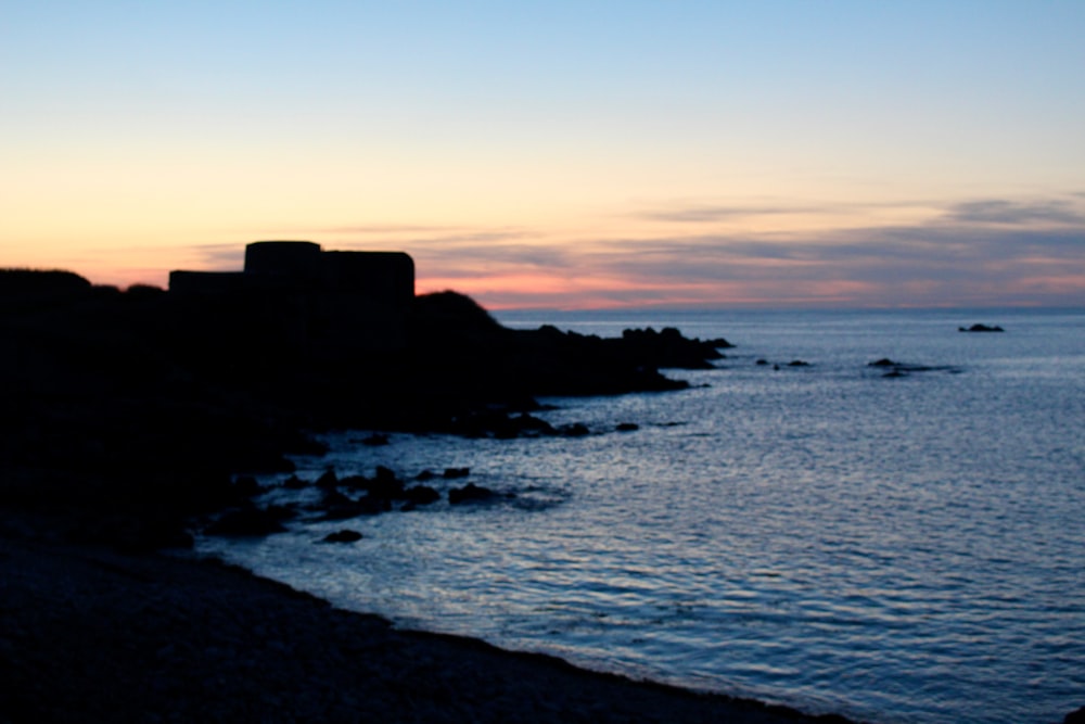 a view of a body of water at sunset