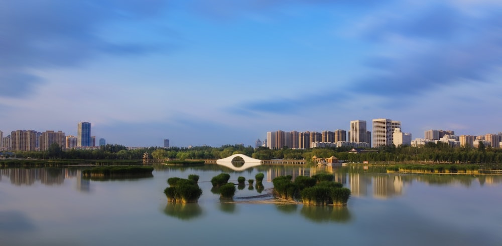 a large body of water with a bridge in the middle of it