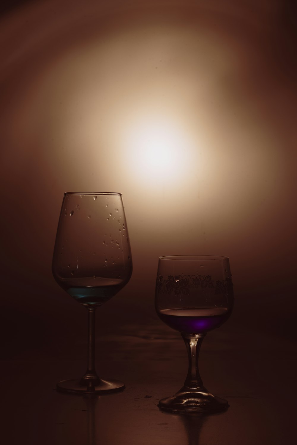 a couple of wine glasses sitting next to each other