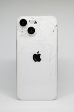 a white iphone with a cracked screen