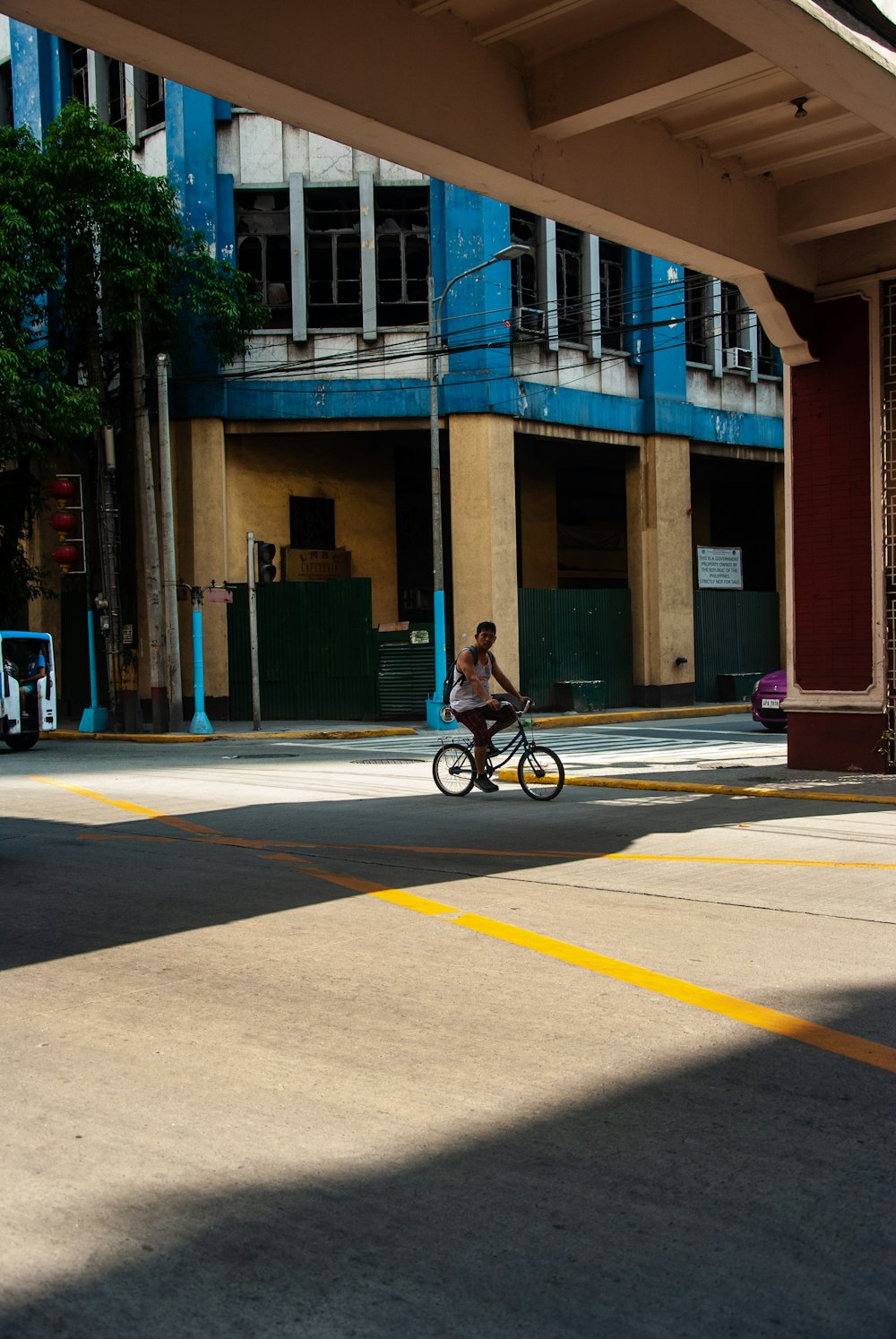 a person riding a bike on a city street