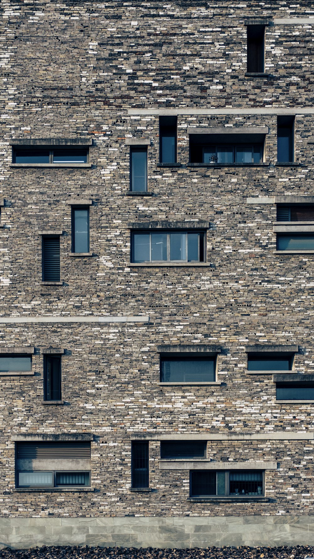 a building with windows and a clock on the side of it