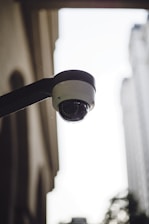 a close up of a security camera on a building