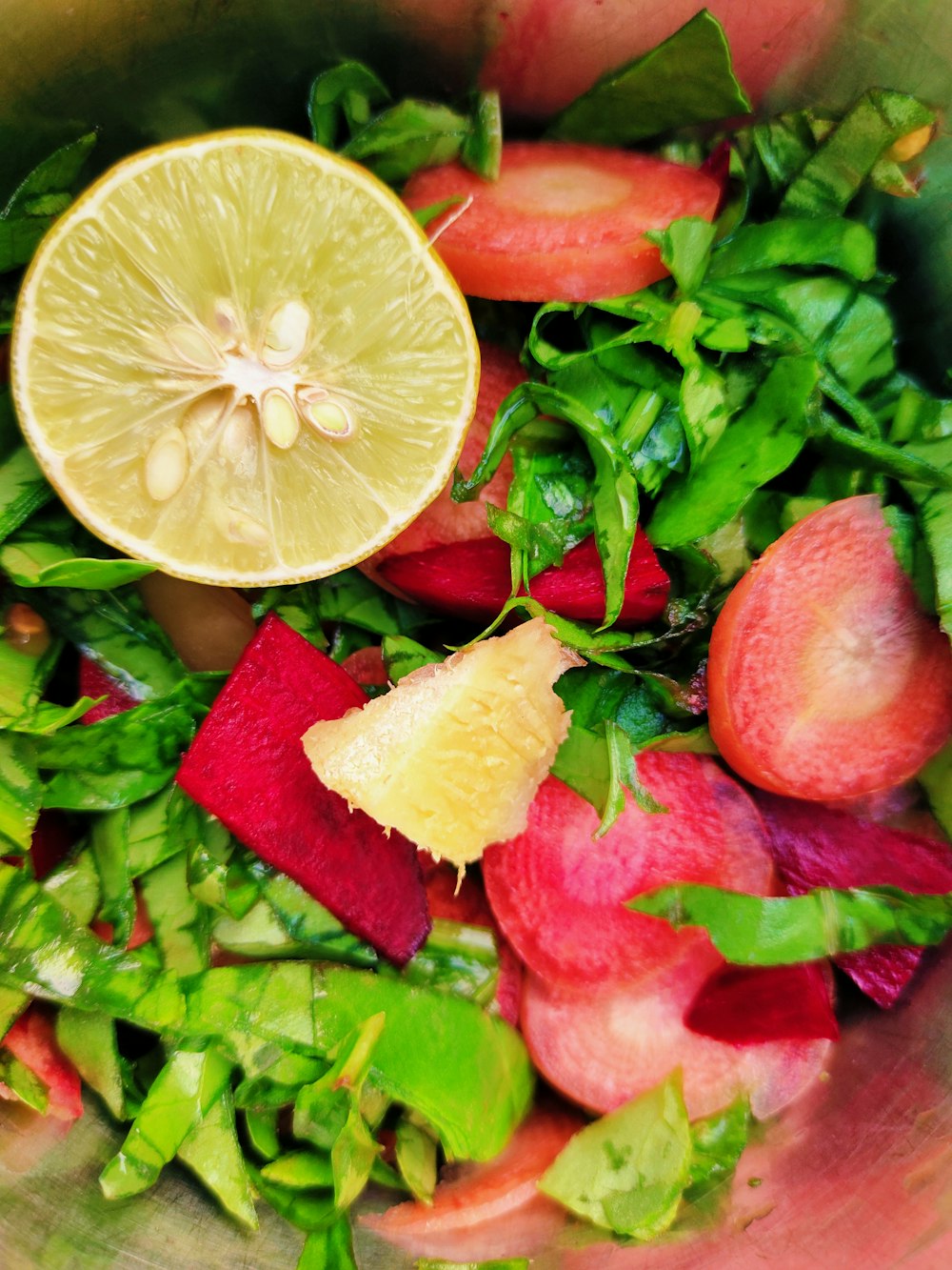 a close up of a bowl of fruit and vegetables