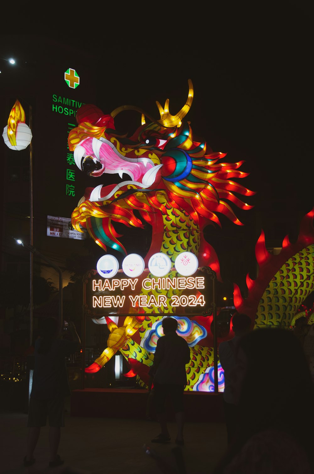 a chinese new year sign lit up at night