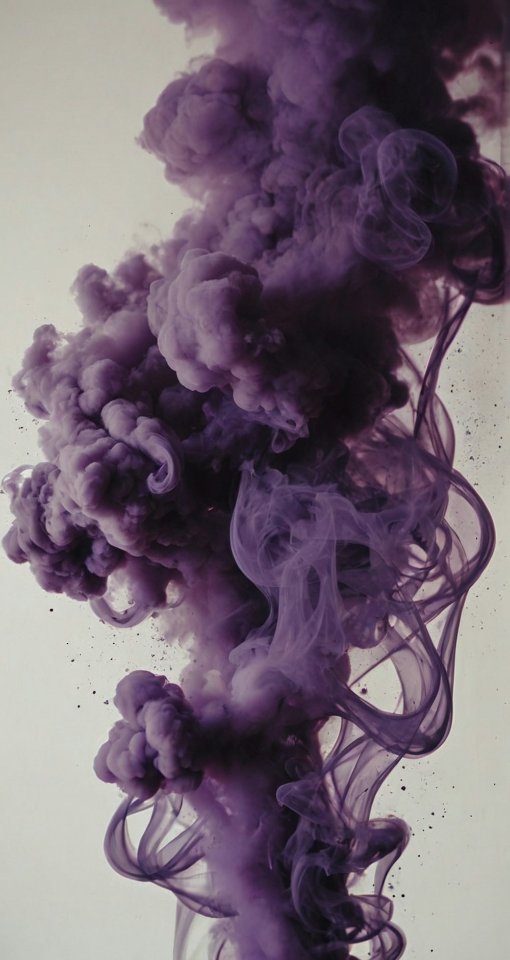 a purple smoke cloud floating in the air
