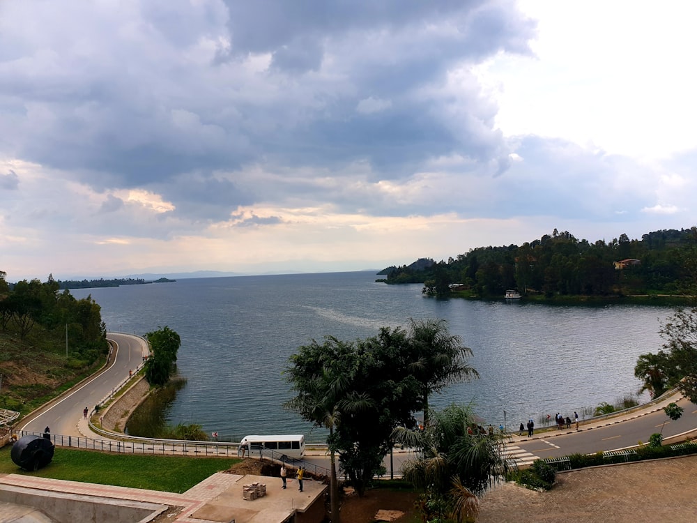 a scenic view of a lake and a highway