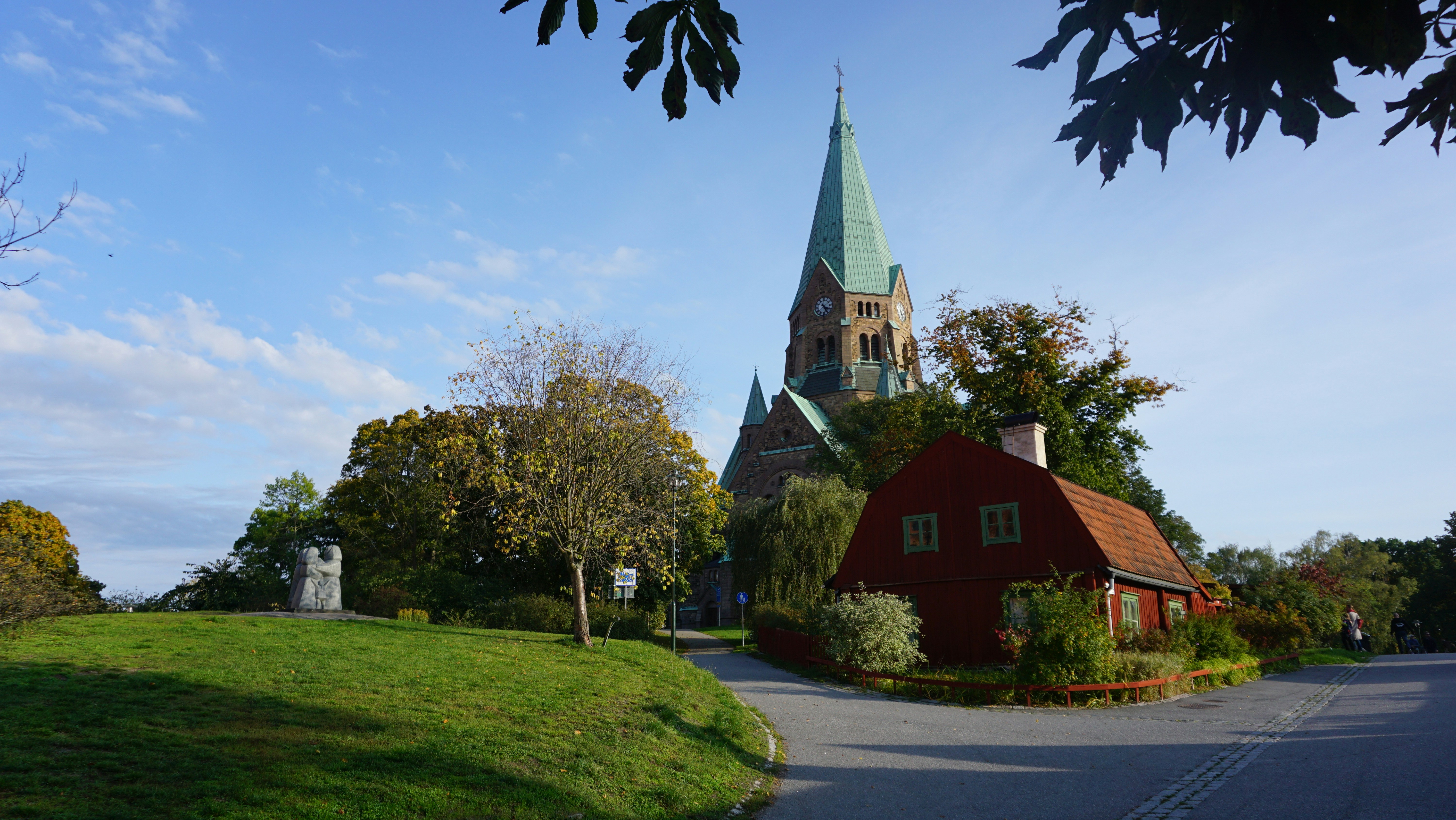 a red building with a steeple on top of it