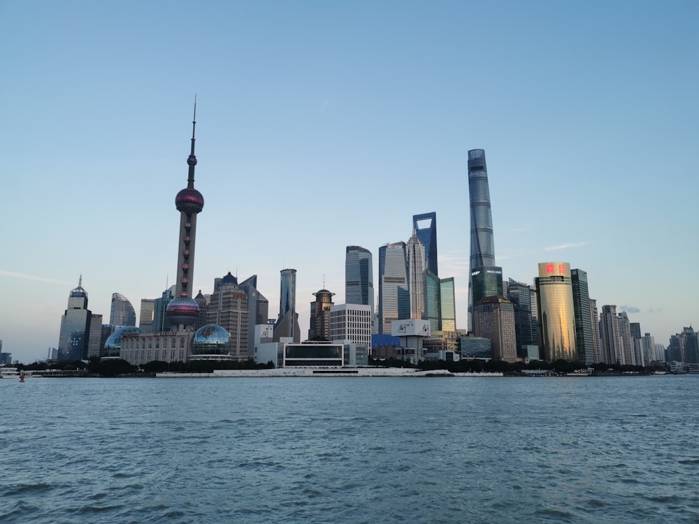 a large body of water with a city in the background