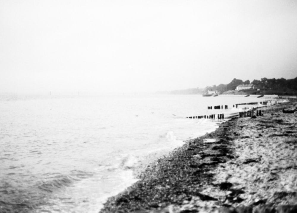 a black and white photo of a beach