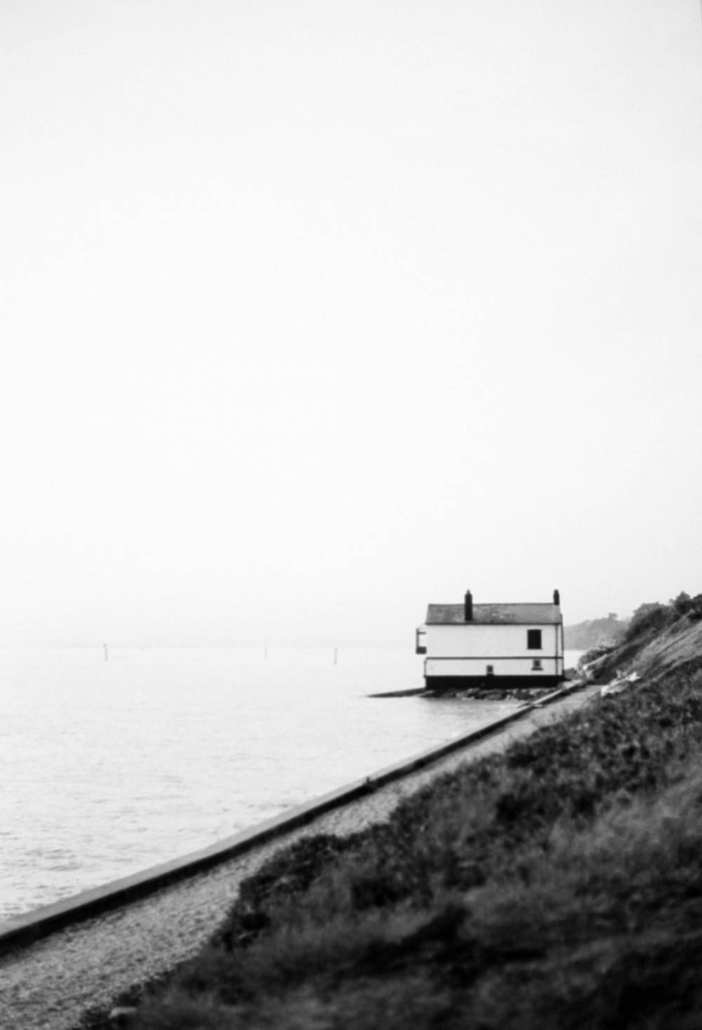 a black and white photo of a boat on a body of water