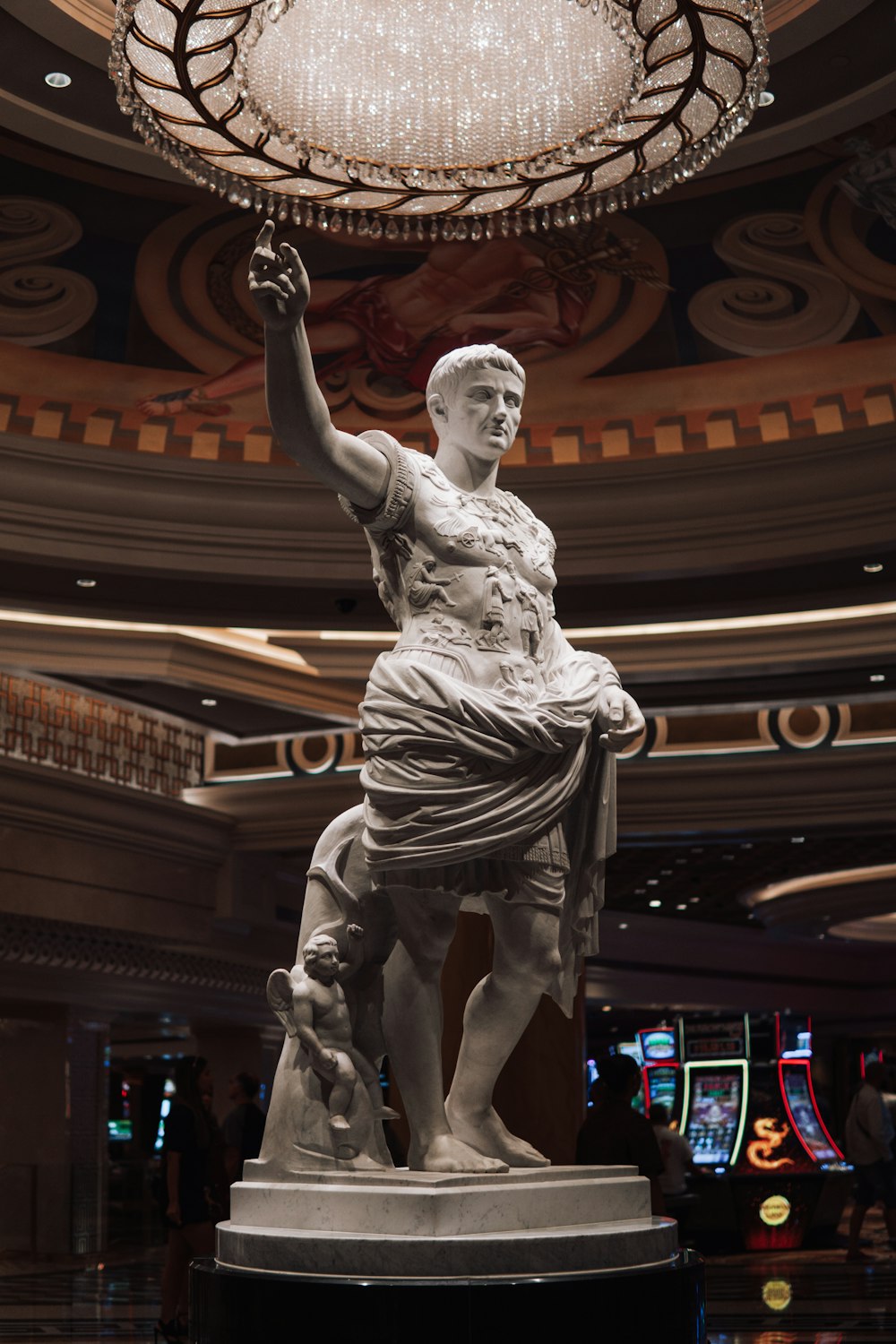 a statue of a woman holding a lamp